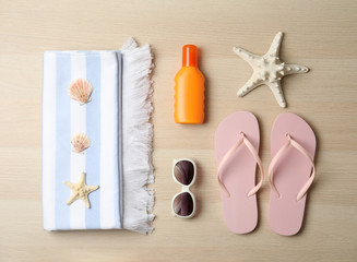 Fototapeta na wymiar Flat lay composition with beach objects on wooden background