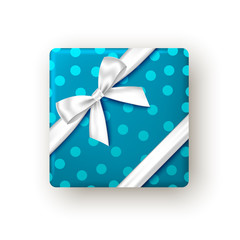 Blue gift box with silver ribbon and bow, top view.