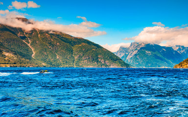 Fototapeta na wymiar Fjord landscape with ferryboat in Norway