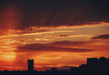 Naklejka na ściany i meble Sunset and storm clouds over the city. Kyiv, Ukraine.