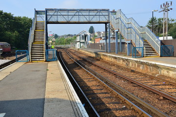 Fototapeta na wymiar Iron footbridge crossing at a station in the Isle of Wight.
