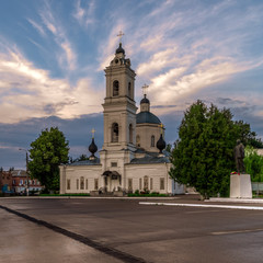 Fototapeta na wymiar Tarusa, Kaluga region, Russia. Cathedral of St. Peter and Paul on the main square of the city against colourful sunset sky.