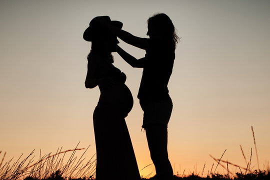 Mesmerizing shot of a lovely pregnant couple - lesbian family concept
