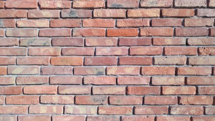 Reddish brickwork with wide cement grouting