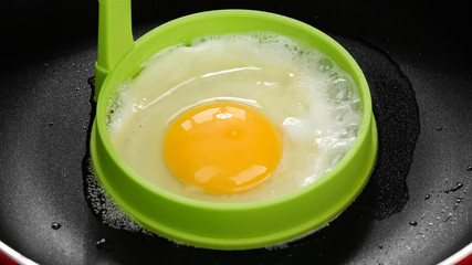frying egg in pan top view