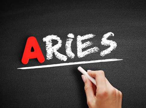 Aries text on blackboard, concept background