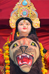 Sculpture of Hindu Goddess Durga, Goddess Durga idol with ornaments in close up side face view