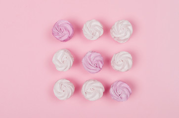 colorful marshmallows on pink background. Color sweet homemade zephyr or marshmallow. Flat lay. copy space