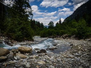 Wild river Kapruner Ache fastly flow down to the Kaprun, Austria, Europe. Best hiking place for families in national park Hohe Tauern in Austrian Alps.