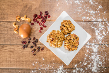 Homemade tasty oatmeal cookies with raisins, dried cranberry and Himalayan mango seeds. Healthy snack concept. Sweet dessert. Close up image. Image on top view..