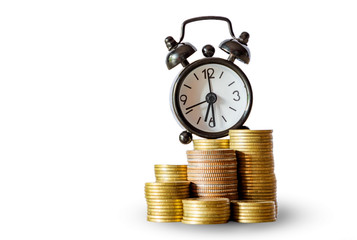 Alarm clock on coins stock , Investment business, retirement, finance and saving money for future concept.