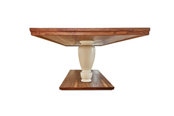 Wooden dinner table on massive legs with dishware isolated against white background