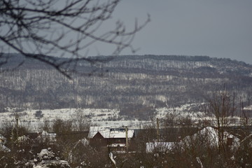 a house in the forest during winter season