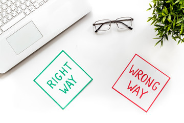 Problem solving. Right and wrong way icons on work desk from above