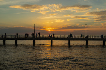 Fototapeta na wymiar The silhouette of the pier