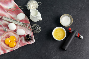food, baking and culinary concept - ingredients and tools for cooking on table