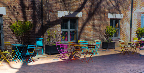 Side street in Sydney CBD colourful chairs against backdrop of brick wall NSW Australia