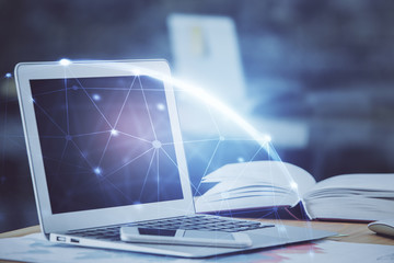 Computer on desktop with social network hologram. Double exposure. Concept of international people connections.