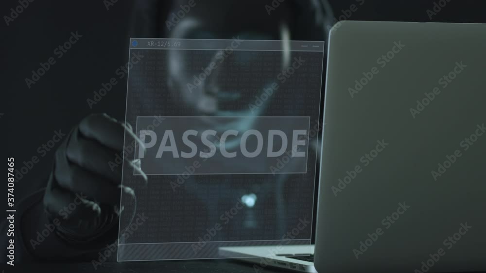 Aufkleber hacker wearing black mask pulls passcode tab from a laptop
