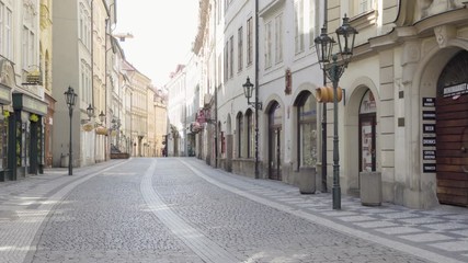 An empty Prague street without people during the coronavirus pandemic - Powered by Adobe