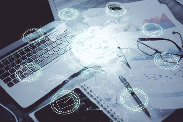 Computer on desktop with social network hologram. Double exposure. Concept of international people connections.