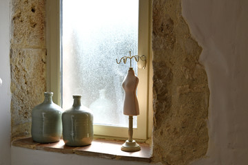 Ornaments on the window sill of a bathroom