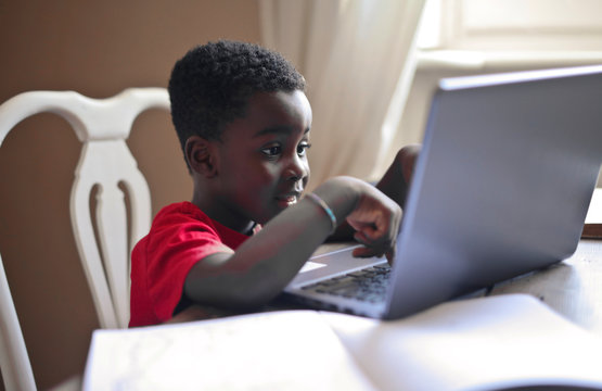 child work with notebook at home