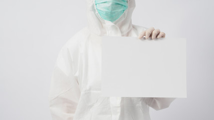 Female wearing PPE and face mask and Hand with gloves is holding A4 paper on white background.