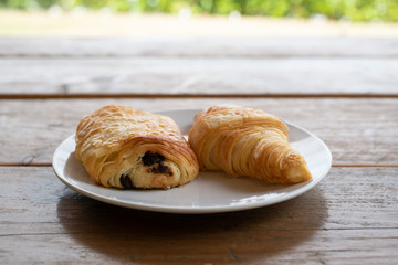 Two Croissants on a white plate