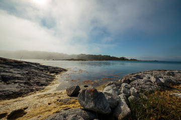 Fog coming in over a bay in the Baltic sea