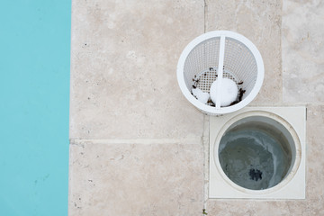 Skimmer basket containing chlorine tablets