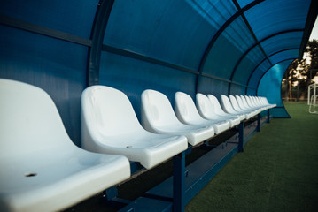 Coach and reserve benches in a soccer field