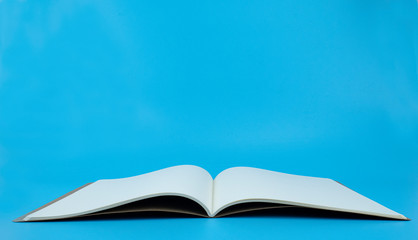 Open the book white page Blank for insert text and subtitles on blue background..