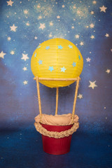 Hot air balloon decoration for a newborn babies photography in a photo studio 