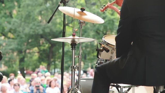 Street performance of the orchestra. Hi-hat from the drums, shaking from the blows of drumsticks.
