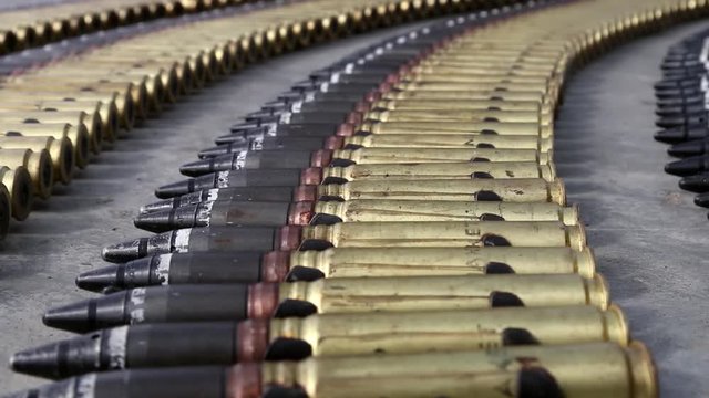 large-caliber ammunition in the belt for an automatic 30 mm gun. The inscription on the ammunition in Russian "Layout"