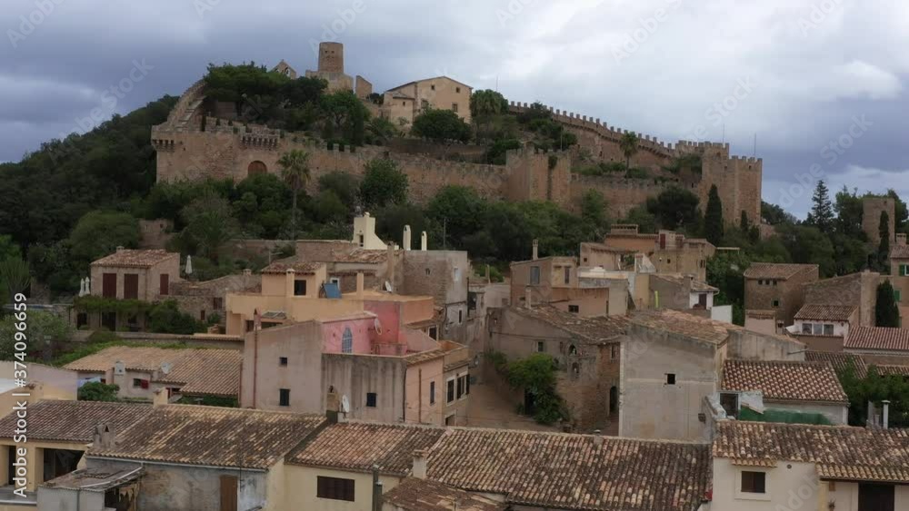 Poster Flying a Fortress drone in the city of Capdepera on the northeast island of Majorca Spain