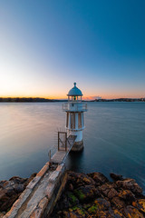 Fototapeta na wymiar Clear sky at dawn at Cremorne Point lighthouse, Sydney, Australia.