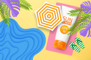 Tube of sun protection cream on drawn beach