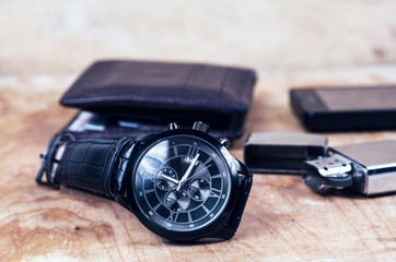 Business wristwatch on the wooden table