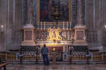 One prayer in church. Bologna, Italy.
