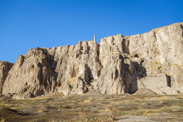 Famous Van Rock & remains of Old city of Van, Turkey. Fortress itself is on background. Most ancient part of it (Tushpa or Van Fortress) is on left part. It was founded by Urartians in 9 century BC