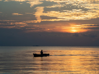 fishing boat at sunset