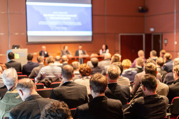 Round table discussion at business convention and presentation. Audience at the conference hall....