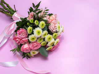 Wedding bouquet on a pink background.