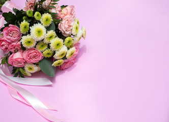 Wedding bouquet on a pink background.