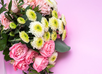 Wedding bouquet on a pink background.