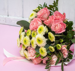 Wedding bouquet of pink roses and chrysanthemums.