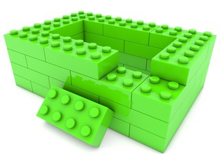 Unfinished green toy brick construction