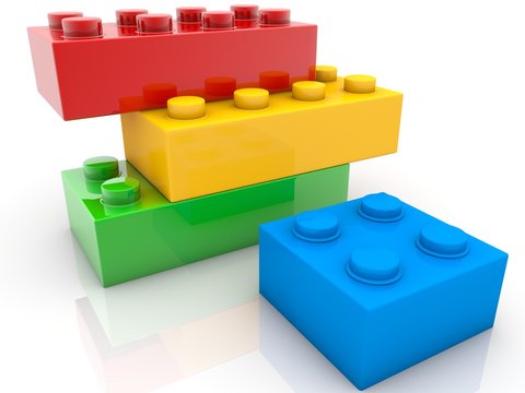 Four toy blocks of different sizes and colors on white